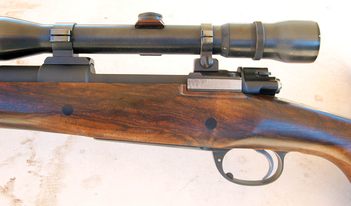 A high-dollar custom Mauser on a commercial action? No thumb cut, but careful examination shows it was welded up, along with the charger cut. Custom work costs several times that of a new Mark X action.